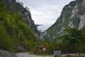 Road in Piva Canyon. Traffic sign with the inscription `Tara Canyon 17 km`.